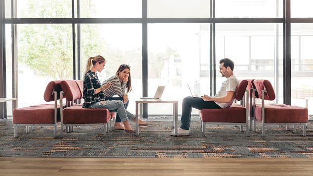 Interface Hard Drive plank carpet tile and Textured Woodgrains in education facility public space with students collaborating